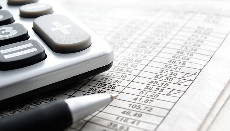 csm_calculator-and-pen-on-financial-spreadsheet.jpg