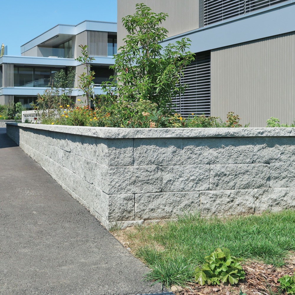 mur-pierre-seche-exterieur-jardin-muret-naturel-amenagement-suisse.jpg